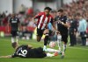 Brentford's Kevin Schade, center, under pressure from Crystal Palace's Joachim Andersen and Joel Ward, right, during the English Premier League soccer match between Crystal Palace vs Brentford FC at the Gtech Community Stadium in London, Saturday Aug. 26, 2023. (John Walton/PA via AP)