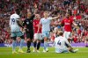 Referee Stuart Attwell shows a red card to Nottingham Forest's Joe Worrall during the English Premier League soccer match between Manchester United and Nottingham Forest at the Old Trafford stadium in Manchester, England, Saturday, Aug. 26, 2023. (AP Photo/Jon Super)
