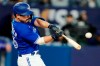 Toronto Blue Jays second baseman Davis Schneider (36) hits a two-run home run against the Cleveland Guardians during first inning MLB baseball action in Toronto on Saturday, August 26, 2023. THE CANADIAN PRESS/Frank Gunn
