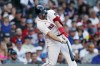 Boston Red Sox's Adam Duvall hits a three-run home run during the sixth inning of a baseball game against the Los Angeles Dodgers, Saturday, Aug. 26, 2023, in Boston. (AP Photo/Michael Dwyer)