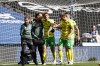 Norwich's Josh Sargent, middle, leaves the field injured during the team's soccer match against Huddersfield on Saturday, Aug. 26, 2023, in Huddersfield, England. (Richard Sellers/PA via AP)