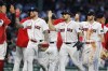 From. left to right, Boston Red Sox's Alex Verdugo, Adam Duvall and Trevor Story celebrate with teammates after defeating the Los Angeles Dodgers in a baseball game, Saturday, Aug. 26, 2023, in Boston. (AP Photo/Michael Dwyer)