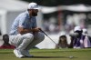 Jon Rahm lines up a putt on the fifth green during the third round of the Tour Championship golf tournament, Saturday, Aug. 26, 2023, in Atlanta. (AP Photo/Mike Stewart)