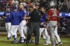 An umpire, center, calls for calm after New York Mets' Pete Alonso, third from left, was hit by a pitch during the eighth inning of a baseball game against the Los Angeles Angels, Saturday, Aug. 26, 2023, in New York. (AP Photo/Bebeto Matthews)