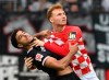 Mainz's Sepp van den Berg, right, and Frankfurt's Omar Marmoush fight for the ball during the German Bundesliga soccer match between FSV Mainz 05 and Eintracht Frankfurt at MEWA Arena stadium, in Mainz, Germany, Sunday Aug. 27, 2023. (Torsten Silz/dpa via AP)