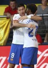 Barcelona's Robert Lewandowski, left, celebrates with Lamine Yamal after scoring his side's fourth goal during a Spanish La Liga soccer match between Villarreal and Barcelona at the Ceramica stadium in Villarreal, Spain, Sunday, Aug. 27, 2023. (AP Photo/Alberto Saiz)