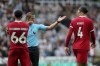 Liverpool's Virgil van Dijk is shown a red card during the English Premier League soccer match between Newcastle United and Liverpool at St. James' Park, in Newcastle upon Tyne, England, Sunday Aug. 27, 2023. (Owen Humphreys/PA via AP)