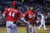 Cincinnati Reds' Will Benson, right, celebrates his run scored against the Arizona Diamondbacks with Reds' Elly De La Cruz (44) during the sixth inning of a baseball game Sunday, Aug. 27, 2023, in Phoenix. (AP Photo/Ross D. Franklin)