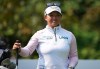 Megan Khang, of the U.S., smiles before hitting her tee shot on the second hole during the final round at the LPGA CPKC Canadian Women's Open golf tournament, in Vancouver, on Sunday, August 27, 2023. THE CANADIAN PRESS/Darryl Dyck