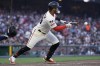 San Francisco Giants' Thairo Estrada bunts for an RBI single during the sixth inning of a baseball game against the Atlanta Braves in San Francisco, Sunday, Aug. 27, 2023. (AP Photo/Jeff Chiu)