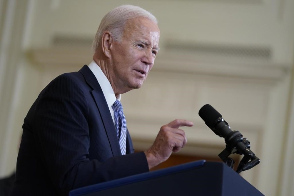 FILE - President Joe Biden speaks on the anniversary of the Inflation Reduction Act during an event in the East Room of the White House, Aug. 16, 2023, in Washington. (AP Photo/Evan Vucci, File)