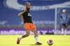 FILE - Newcastle's Nabil Bentaleb warms up before their English Premier League soccer match against Brighton at the American Express Community Stadium in Brighton, England, Monday, July 20, 2020. Algeria midfielder Nabil Bentaleb has on Monday, Aug. 28, 2023 signed a three-year contract with Lille that will see him return to the French league club where he honed his skills as a youngster. (Mike Hewitt/Pool via AP, file)
