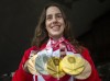 Three years between Paralympic Games instead of four has Paris 2024 coming at high speed for champion swimmer Aurelie Rivard. Rivard holds her five Paralympic swimming medals at a news conference, Wednesday, September 8, 2021 in Montreal. THE CANADIAN PRESS/Ryan Remiorz