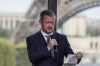 Andrew Parsons, President of the International Paralympic Committee of the Paris 2024 Games, gestures as speaks during a media conference in Paris, Monday, Aug. 28, 2023. Olympic and Paralympic organizers unveil plans and ambitions for next summer's Paralympic games in Paris that start just over two weeks after the Paris Olympic games end. Eiffel Tower in the background. (AP Photo/Michel Euler)