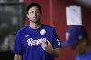 Texas Rangers' Max Scherzer flips the ball in the air as he paces the duguout during the seventh inning of a baseball game against the Arizona Diamondbacks Tuesday, Aug. 22, 2023, in Phoenix. The Diamondbacks won 6-3. (AP Photo/Ross D. Franklin)