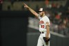 Baltimore Orioles starting pitcher Grayson Rodriguez reacts after center fielder Cedric Mullins made a catch on a ball hit by Chicago White Sox's Yoan Moncada during the fifth inning of a baseball game, Monday, Aug. 28, 2023, in Baltimore. (AP Photo/Julio Cortez)