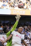 Tottenham's Richarlison, right, and Manchester United's goalkeeper Andre Onana challenge for the ball during the Premier League soccer match between Tottenham Hotspur and Manchester United at the Tottenham Hotspur Stadium in London, England, Saturday, Aug. 19, 2023. (AP Photo/Alberto Pezzali)