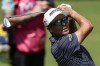 Rickie Fowler hits from the first fairway during the third round of the Tour Championship golf tournament, Saturday, Aug. 26, 2023, in Atlanta. (AP Photo/Mike Stewart)