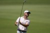 Brian Harman watches his ball on the first fairway during the third round of the Tour Championship golf tournament, Saturday, Aug. 26, 2023, in Atlanta. (AP Photo/Mike Stewart)