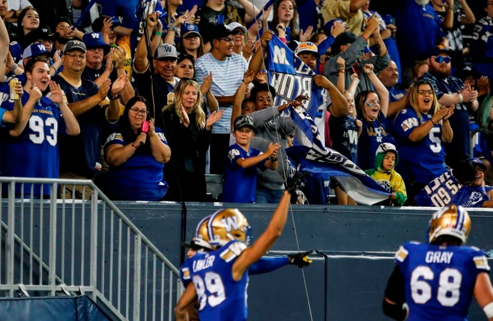 The Winnipeg Blue Bombers can become the first CFL team to cement a playoff spot this weekend. Winnipeg Blue Bombers' Kenny Lawler (89) celebrates his touchdown with the fans during second half CFL action against the Montreal Alouettes in Winnipeg, Thursday, Aug. 24, 2023. THE CANADIAN PRESS/John Woods