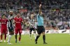 Liverpool's Virgil van Dijk, not pictured, is shown a red card during the English Premier League soccer match between Newcastle United and Liverpool at St. James' Park, in Newcastle upon Tyne, England, Sunday Aug. 27, 2023. (Owen Humphreys/PA via AP)