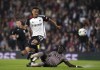 Fulham's Rodrigo Muniz, left, and Tottenham Hotspur's Davinson Sanchez battle for the ball during the Carabao Cup second round soccer match at Craven Cottage, London, Tuesday Aug. 29, 2023. (John Walton/PA via AP)