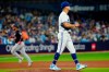 Toronto Blue Jays starting pitcher Jose Berrios (17) reacts as Washington Nationals' Keibert Ruiz (20) rounds the bases after hitting a three-run home run during fifth inning MLB baseball action in Toronto on Tuesday, August 29, 2023. THE CANADIAN PRESS/Frank Gunn