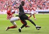 Mainz's Sepp van den Berg, left, and Frankfurt's Randal Kolo Muani fight for the ball during the German Bundesliga soccer match between FSV Mainz 05 and Eintracht Frankfurt at MEWA Arena stadium, in Mainz, Germany, Sunday Aug. 27, 2023. (Torsten Silz/dpa via AP)