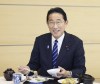 In this photo provided by Cabinet Public Affairs Office, Japanese Prime Minister Fumio Kishida eats the seafood from Fukushima prefecture at lunch at the prime minister's office in Tokyo, Japan, Wednesday, Aug. 30, 2023. (Cabinet Public Affairs Office via AP)