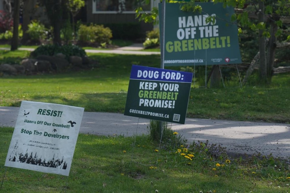 Signboards voicing opposition to the Ontario Government's plans for the Greenbelt are seen outside homes withn the Duffins Rouge Agricultural Preserve, part of Ontario's Greenbelt, on May 15, 2023, THE CANADIAN PRESS/Chris Young