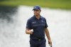 FILE - Gary Woodland reacts on the 14th green during the final round of the Wells Fargo Championship golf tournament at the Quail Hollow Club on Sunday, May 7, 2023, in Charlotte, N.C. The former U.S. Open champion announced Wednesday, Aug. 30, he will have surgery on Sept. 18 to remove a lesion found on his brain. (AP Photo/Chris Carlson, File)