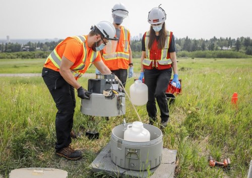 University of Calgary researchers check monitoring equipment as they track traces of COVID-19 in the wastewater system in Calgary on July 14, 2021. Researchers say the amount of opioids and other illicit drugs found in a monitoring of Alberta wastewater jumped in June. THE CANADIAN PRESS/Jeff McIntosh