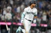 Seattle Mariners' Julio Rodriguez flips his bat after hitting a two-run home run to score J.P. Crawford against the Oakland Athletics during the fourth inning of a baseball game, Monday, Aug. 28, 2023, in Seattle. (AP Photo/Lindsey Wasson)