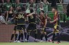 Seattle Sounders FC defender Nouhou Tolo (5) celebrates with teammates after his goal against Austin FC during the second half of an MLS soccer match in Austin, Texas, Wednesday, Aug. 30, 2023. (AP Photo/Eric Gay)
