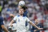FILE - England's Jordan Henderson, front, heads for the ball with France's Adrien Rabiot during the World Cup quarterfinal soccer match between England and France, at the Al Bayt Stadium in Al Khor, Qatar, Saturday, Dec. 10, 2022. Moving to Saudi Arabia hasn’t stopped Jordan Henderson getting called up by England. The former Liverpool captain was included in the 26-man squad on Thursday, Aug. 31, 2023 for upcoming games against Ukraine and Scotland even though he now plays for Al-Ettifaq. He is one of the growing number of top players to take lucrative sums of money in the oil-rich kingdom. (AP Photo/Christophe Ena, File)