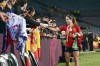 Spain's Aitana Bonmati celebrates with fans after the final of Women's World Cup soccer between Spain and England at Stadium Australia in Sydney, Australia, Sunday, Aug. 20, 2023. (AP Photo/Steve Markham)