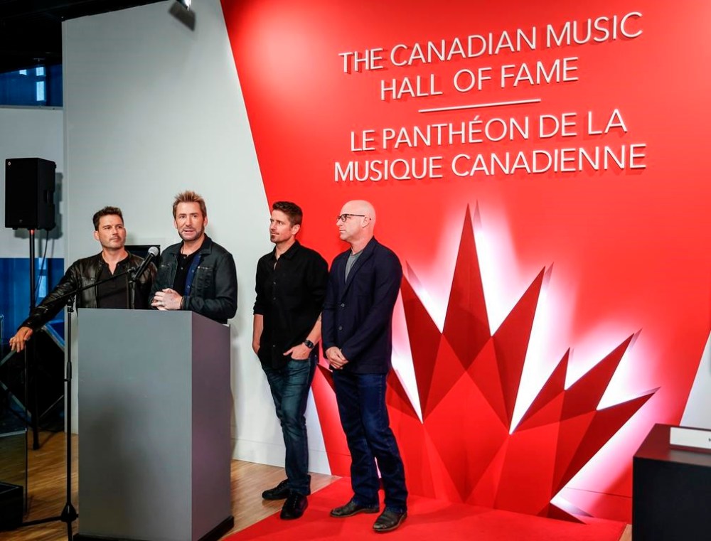 Members of the band Nickelback, consisting of, left to right, Ryan Peake, Chad Kroeger, Daniel Adair and Mike Kroeger attend a Canadian Music Hall of Fame plaque ceremony in Calgary on Sunday, June 25, 2023. Canadian rockers Nickelback, South African rapper Sho Madjozi and Finn Wolfhard’s band The Aubreys are among the artists set to perform at the Toronto International Film Festival’s annual street party. THE CANADIAN PRESS/Jeff McIntosh