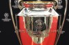 The trophy is on display before the 2023/24 UEFA Champions League group stage draw at the Grimaldi Forum in Monaco, Thursday, Aug. 31, 2013. (AP Photo/Daniel Cole)