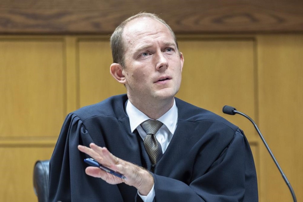 Fulton County Superior Court Judge Scott McAfee presides over a hearing regarding media access in the case against former President Donald Trump and 18 others at the Fulton County Courthouse in Atlanta, Thursday, Aug, 31, 2023. (Arvin Temkar/Atlanta Journal-Constitution via AP, Pool)