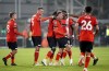 Luton Town's Alfie Doughty, center, celebrates scoring during the Carabao Cup second round match between Luton Town and Gillingham at Kenilworth Road, Luton, England, Tuesday Aug. 29, 2023. (Joe Giddens/PA via AP)