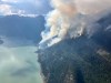 About 160 firefighters battling a blaze in the British Columbia Interior have had to pull out of their camp after they were subjected to what the BC Wildfire Service calls 