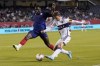 Vancouver Whitecaps midfielder Ryan Gauld, right, shoots against Chicago Fire defender Carlos Terán during the first half of an MLS soccer game in Chicago, Wednesday, Aug. 30, 2023. THE CANADIAN PRESS/AP-Nam Y. Huh