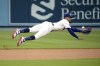 Los Angeles Dodgers second baseman Mookie Betts can't get to a ball hit for a single by Atlanta Braves' Ronald Acuna Jr. during the first inning of a baseball game Thursday, Aug. 31, 2023, in Los Angeles. (AP Photo/Mark J. Terrill)