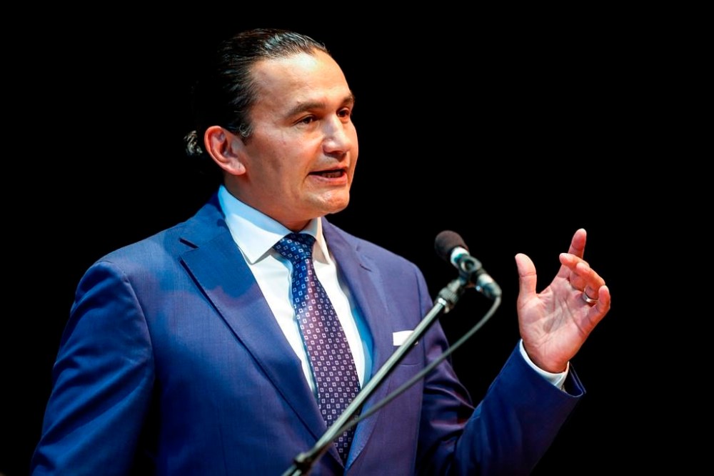 Wab Kinew's path as a young man, including several brushes with the law and some convictions, did not appear a likely path to politics. Kinew, leader of the Manitoba NDP, speaks to party faithful during an event at the Canadian Mennonite University in Winnipeg on Wednesday, Aug. 16, 2023. THE CANADIAN PRESS/John Woods