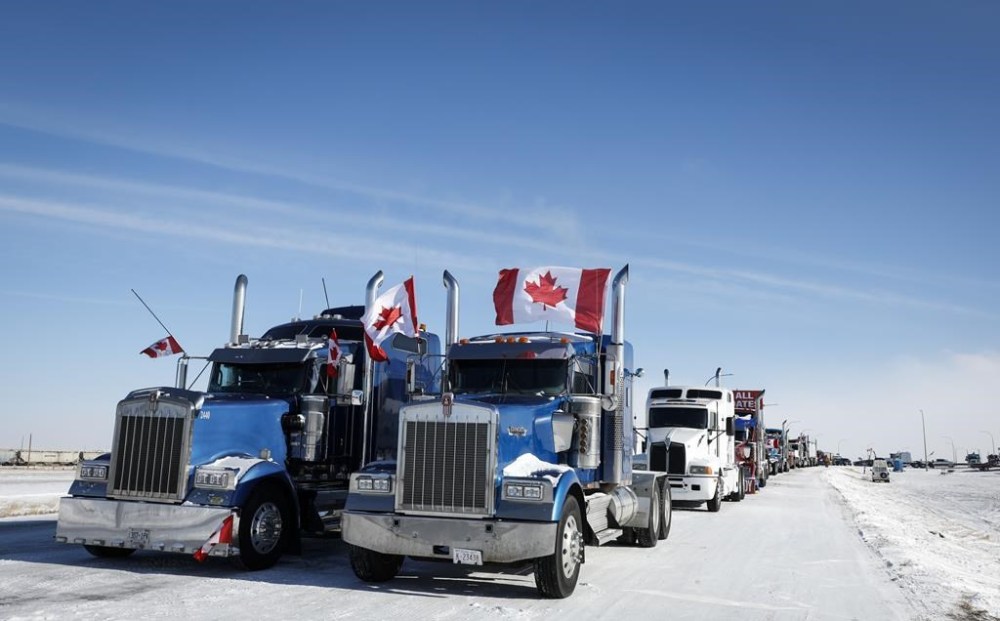 A truck convoy of anti-COVID-19 vaccine mandate demonstrators continue to block the highway at the busy U.S. border crossing in Coutts, Alta., Wednesday, Feb. 2, 2022.THE CANADIAN PRESS/Jeff McIntosh