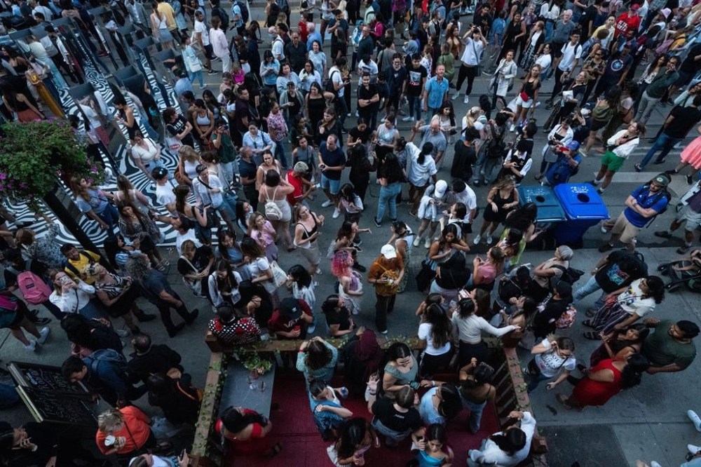 Fans of Taylor Swift have an impromptu dance party during the Toronto International Film Festival in Toronto, Ont., on Friday, Sept. 9, 2022. THE CANADIAN PRESS/Alex Lupul