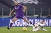 FILE - Fiorentina's Sofyan Amrabat, left, competes for the ball with Juventus' Alvaro Morata during the Serie A soccer match between Juventus and Fiorentina, at the Allianz Stadium in Turin, Italy, Tuesday, Dec. 22, 2020. Manchester United seems like the likely destination for Fiorentina midfielder Sofyan Amrabat. The English club is reportedly set to pay 10 million euros ($11 million) for an initial loan deal with an option to buy the Morocco international for a further 20 million euros ($22 million). (Fabio Ferrari/LaPresse via AP, File)