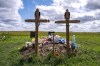 The graves of Thomas Burns and Carol Burns, who were killed in the 2022 mass stabbing event, are shown at the cemetery on the grounds of St. Stephen's Anglican Church in James Smith Cree Nation, Sask., Wednesday, August 9, 2023. Members of a Saskatchewan First Nation are to quietly gather today to mark the one-year anniversary of a mass stabbing. THE CANADIAN PRESS/Liam Richards
