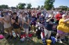 FILE - A crowd cheers as Jim Caviezel speaks during a 