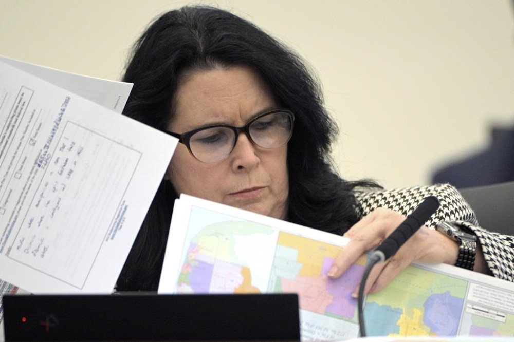 FILE - State Sen. Kelli Stargel looks through redistricting maps during a Senate Committee on Reapportionment hearing on Jan. 13, 2022, in Tallahassee, Fla. A Florida redistricting plan pushed by Gov. Ron DeSantis violates the state constitution and is prohibited from being used for any future U.S. congressional elections since it diminishes the ability of Black voters in north Florida to pick a representative of their choice, a state judge ruled Saturday, Sept. 2, 2023. (AP Photo/Phelan M. Ebenhack, File)